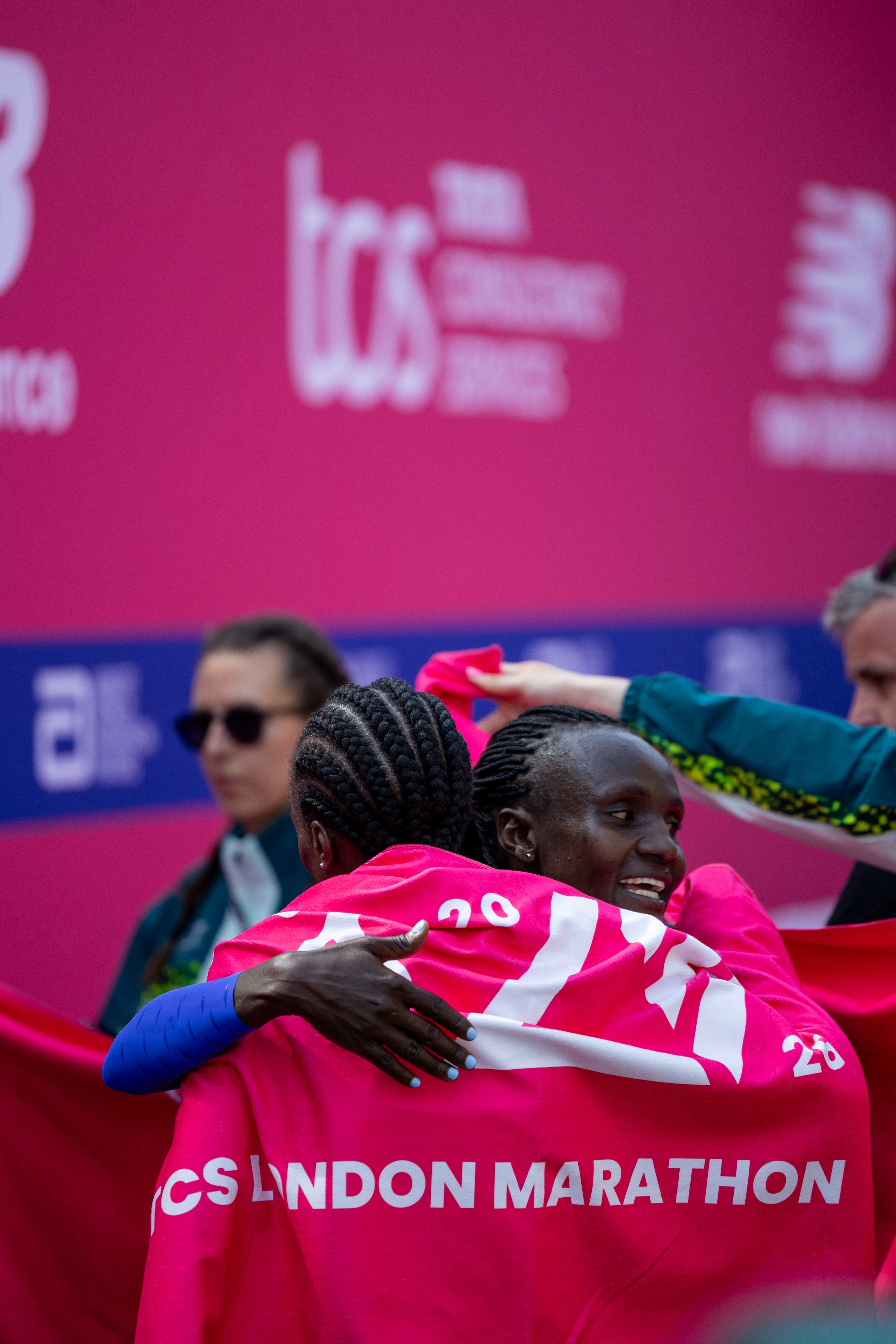 Athletes embracing at the TCS London Marathon 2026 finish line